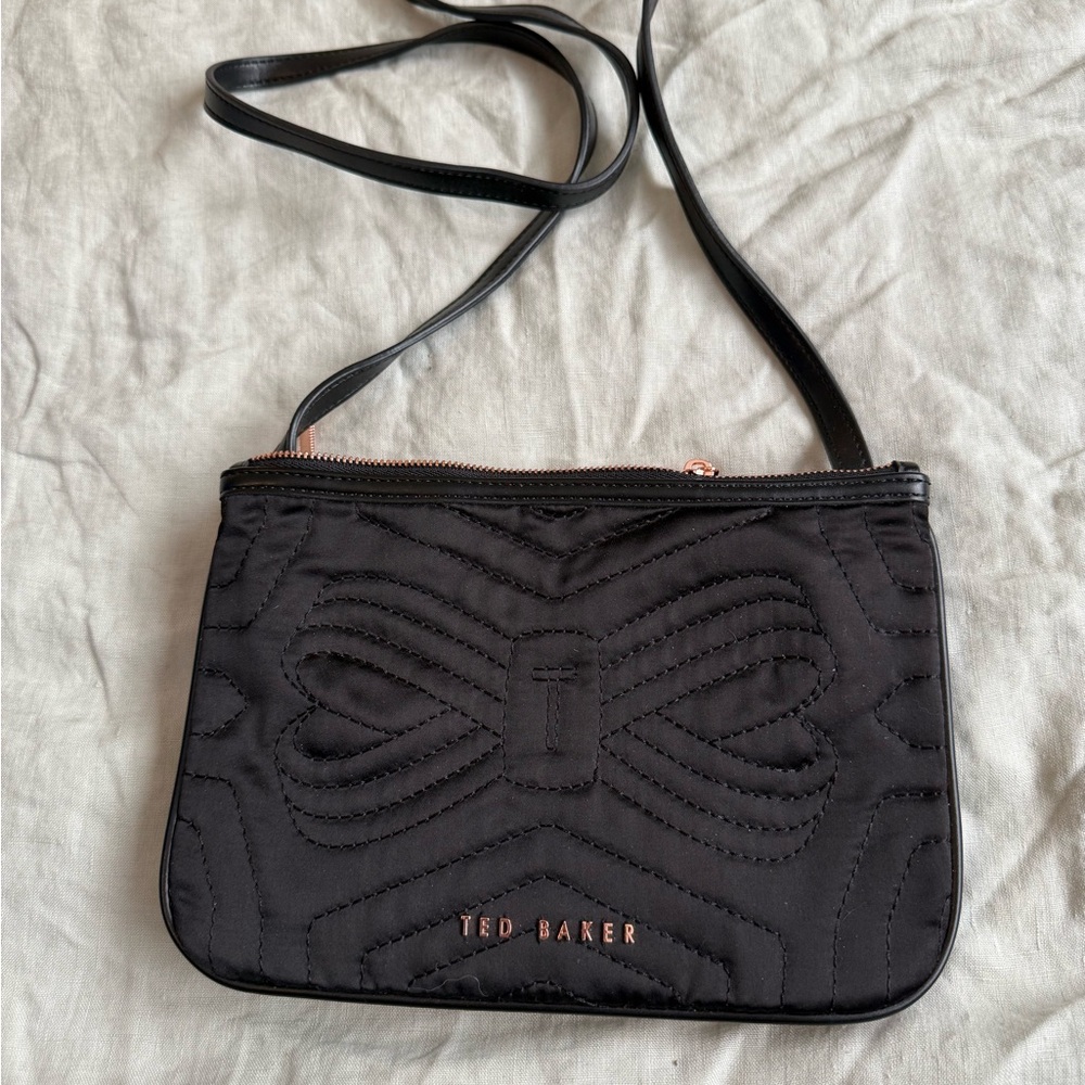 Ted Baker Black Quilted crossbody with Rose Gold metal lettering and zippers.